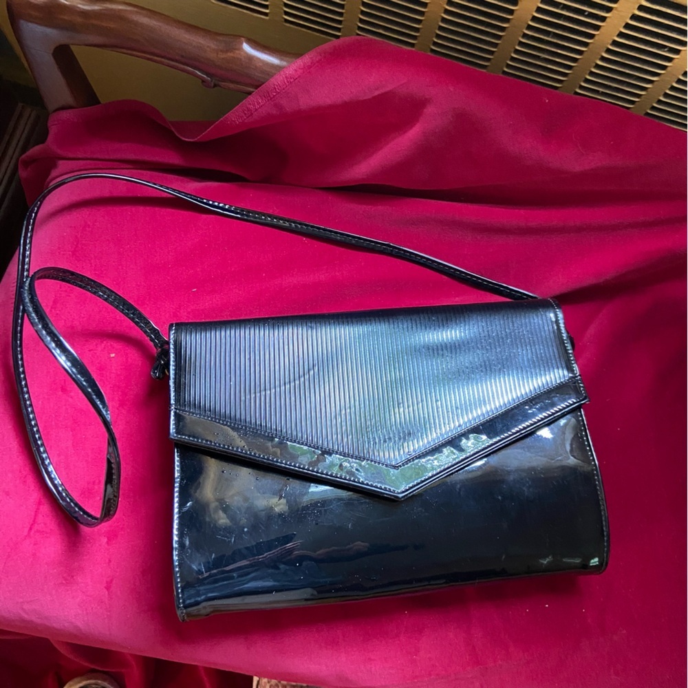 Shiny black vinyl cross body purse. Great day or night. Essential for every girl